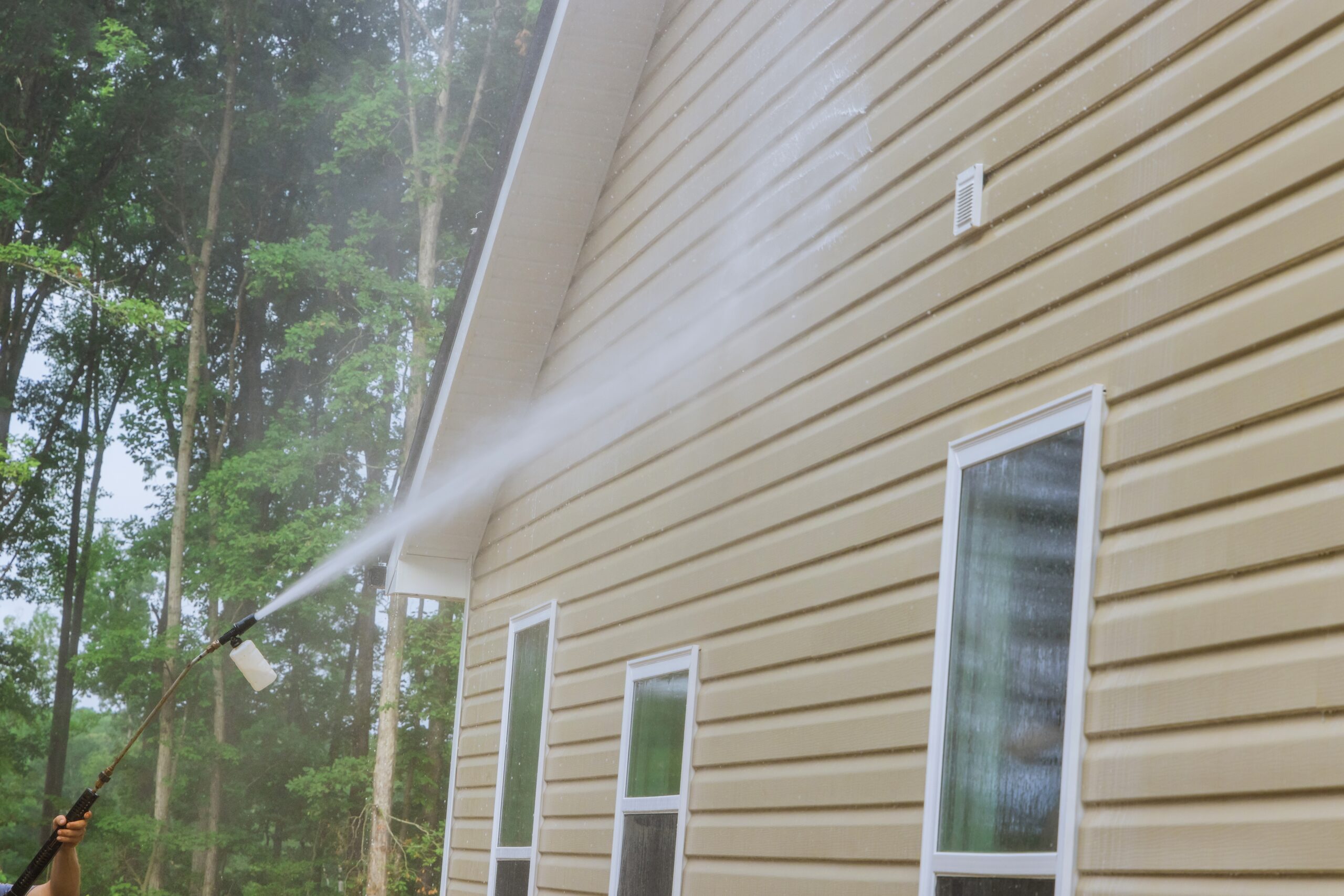 home being power washed on siding and windows